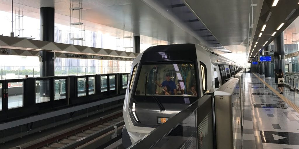 A train at a covered urban rail station
